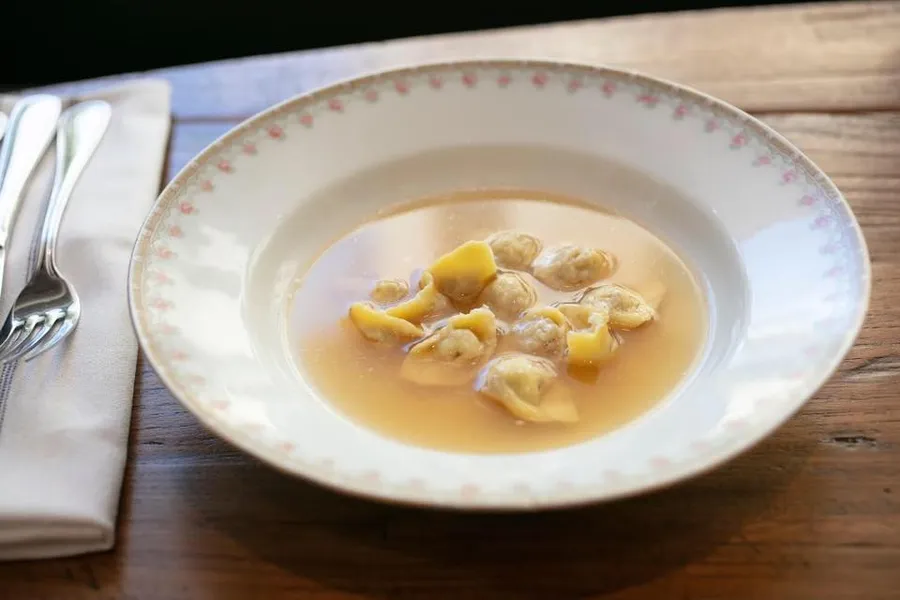 Gianna's signature dishes Tortellini in BrodoGrilled Gulf FishProsciutto and Mortadella Board